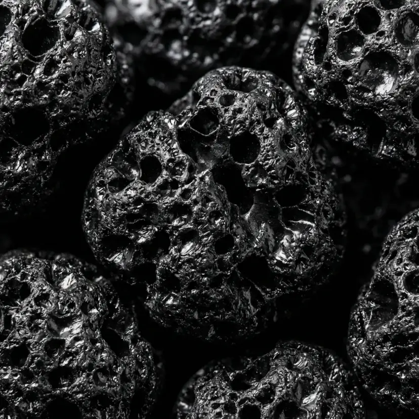 Close-up of Purrify activated carbon granules showing the porous surface that traps ammonia